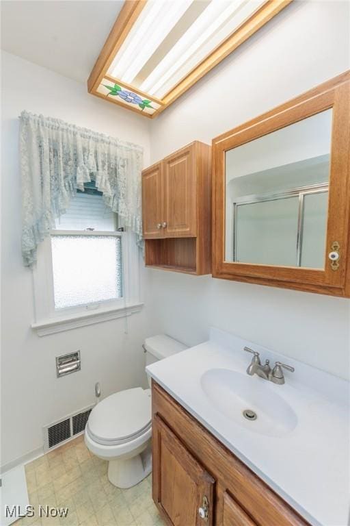 4766 Brookwood Dr, Brooklyn, OH 44144 - bathroom featuring vanity and a shower with shower door