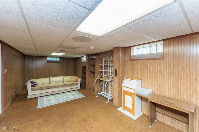 4766 Brookwood Dr, Brooklyn, OH 44144 - carpeted living room with wood walls and a drop ceiling