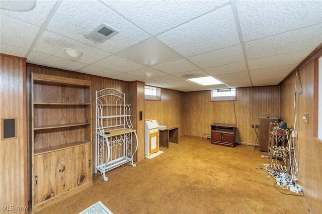 4766 Brookwood Dr, Brooklyn, OH 44144 - basement featuring light colored carpet, wooden walls, and a drop ceiling