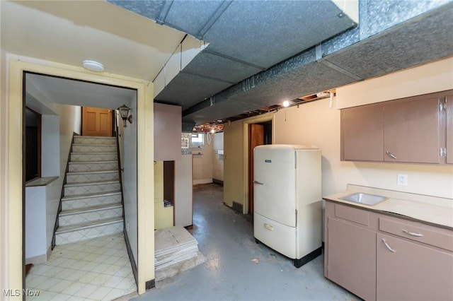 4766 Brookwood Dr, Brooklyn, OH 44144 - basement featuring stairs and freestanding refrigerator