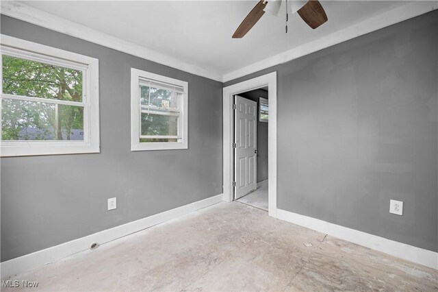 2922 Cory Ave, Akron, OH 44314 - spare room with baseboards and ceiling fan