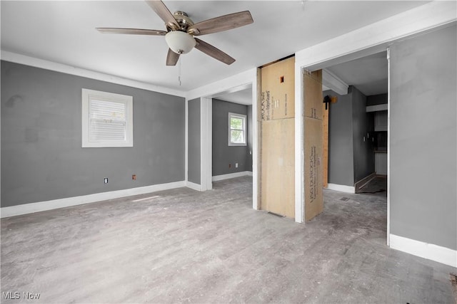 2922 Cory Ave, Akron, OH 44314 - empty room featuring a ceiling fan and a barn door