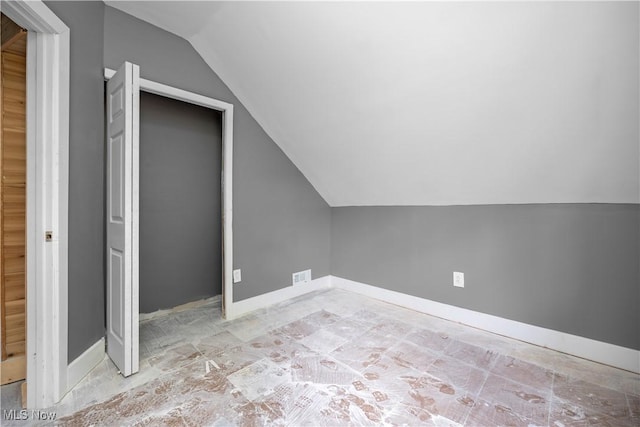 2922 Cory Ave, Akron, OH 44314 - additional living space featuring vaulted ceiling and baseboards