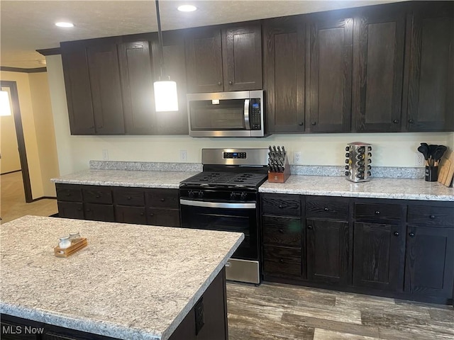 83478 Monzula Rd, Cadiz, OH 43907 - kitchen with stainless steel appliances, wood finished floors, recessed lighting, and ornamental molding