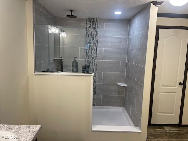 83478 Monzula Rd, Cadiz, OH 43907 - bathroom featuring a walk in shower, vanity, and wood finished floors