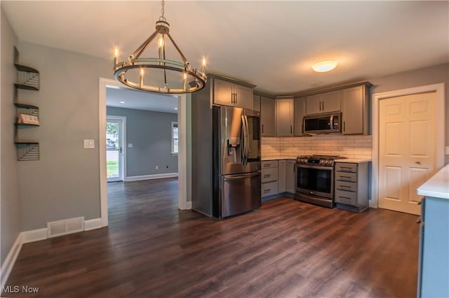 216 W Glenridge Rd, Green, OH 44319 - kitchen featuring appliances with stainless steel finishes, gray cabinets, a chandelier, light countertops, and tasteful backsplash