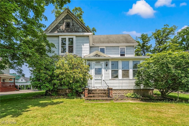 13778 Spring St, Burton, OH 44021 - view of front facade featuring entry steps and a front lawn