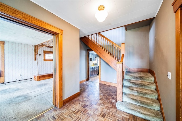13778 Spring St, Burton, OH 44021 - stairway with baseboards and a baseboard heating unit