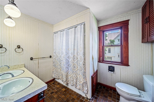 13778 Spring St, Burton, OH 44021 - full bath with double vanity, wallpapered walls, and brick patterned floors