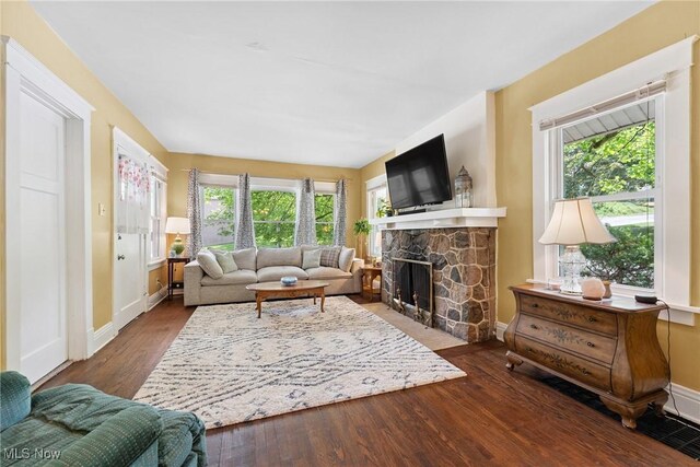 1901 Newton St, Akron, OH 44305 - living room with wood finished floors, plenty of natural light, and a fireplace