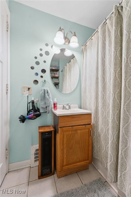 1901 Newton St, Akron, OH 44305 - full bathroom with tile patterned flooring, vanity, and curtained shower