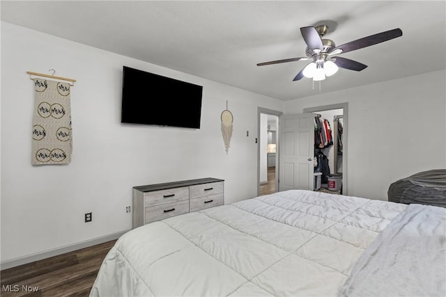 16792 Gonzales Ave, East Liverpool, OH 43920 - bedroom with dark wood-type flooring, a ceiling fan, and a walk in closet