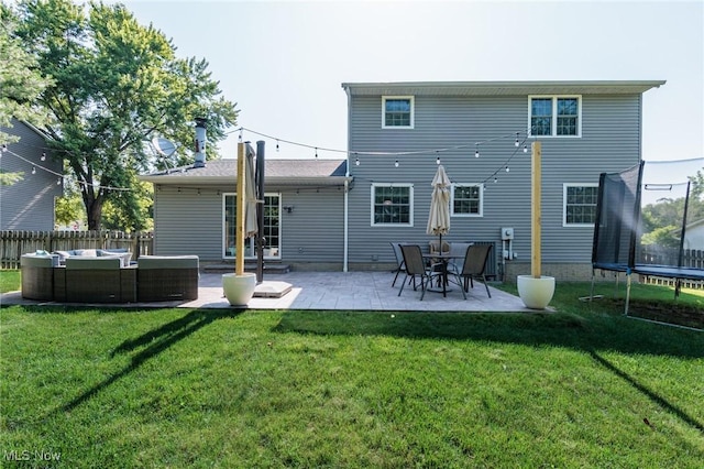 14344 S Gateway Dr, North Royalton, OH 44133 - back of property featuring a trampoline, an outdoor living space, and a patio area