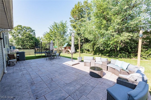 14344 S Gateway Dr, North Royalton, OH 44133 - view of patio featuring a playground, a trampoline, and outdoor lounge area