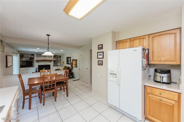 14344 S Gateway Dr, North Royalton, OH 44133 - dining room with a fireplace, light tile patterned floors, and recessed lighting