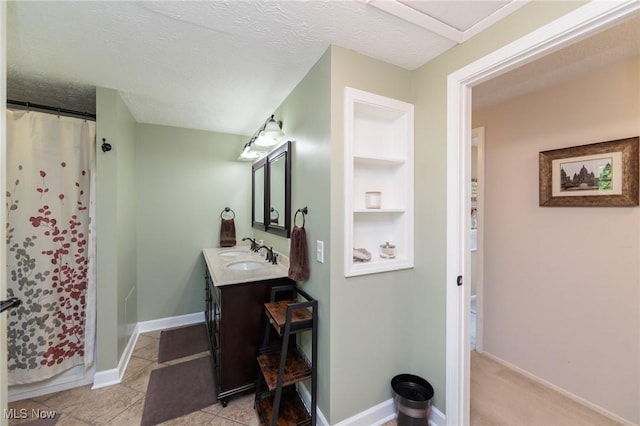 14344 S Gateway Dr, North Royalton, OH 44133 - bathroom featuring vanity, curtained shower, and a textured ceiling