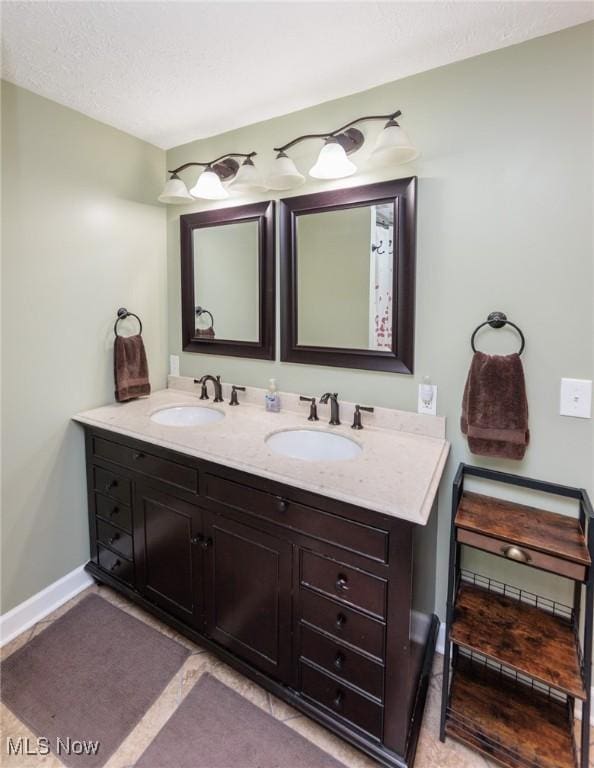 14344 S Gateway Dr, North Royalton, OH 44133 - bathroom with double vanity and baseboards