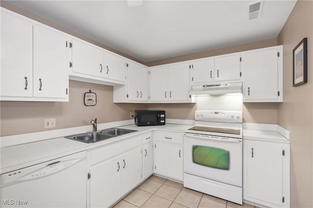 2021 King James Pkwy Unit 228, Westlake, OH 44145 - kitchen with white appliances, under cabinet range hood, and white cabinetry