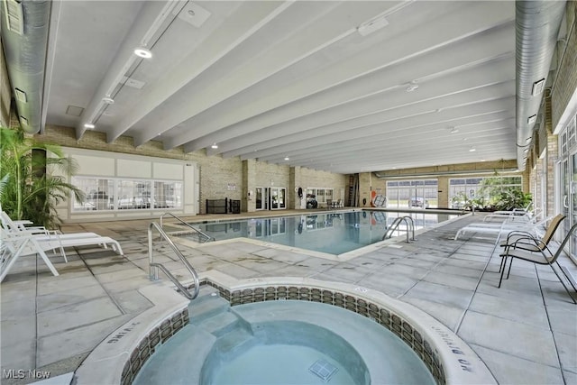 2021 King James Pkwy Unit 228, Westlake, OH 44145 - indoor pool featuring an in-ground hot tub and a patio area