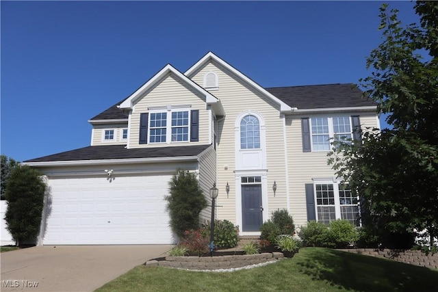 7509 Galena Ave NW, Canal Fulton, OH 44614 - traditional-style home with driveway, a garage, and a shingled roof