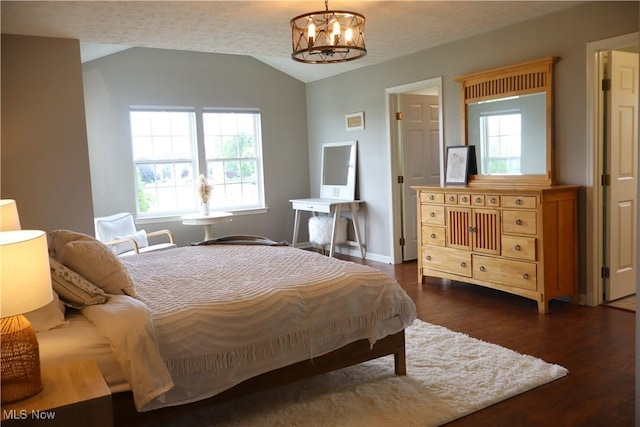 7509 Galena Ave NW, Canal Fulton, OH 44614 - bedroom featuring vaulted ceiling, a chandelier, and wood finished floors