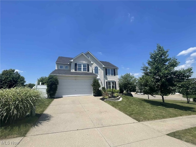 7509 Galena Ave NW, Canal Fulton, OH 44614 - traditional home featuring concrete driveway, a garage, and a front lawn