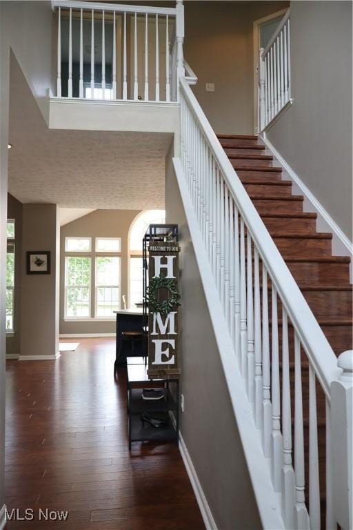 7509 Galena Ave NW, Canal Fulton, OH 44614 - stairway featuring wood finished floors and a towering ceiling