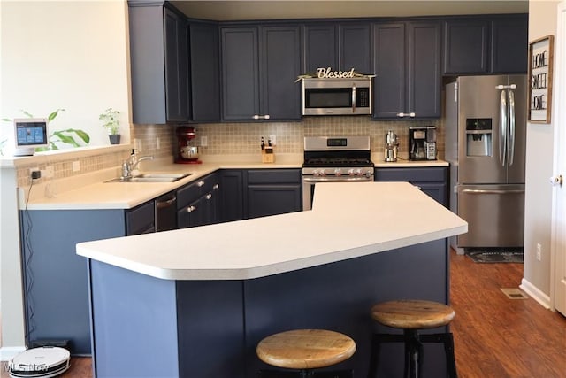 7509 Galena Ave NW, Canal Fulton, OH 44614 - kitchen with appliances with stainless steel finishes, decorative backsplash, and light countertops