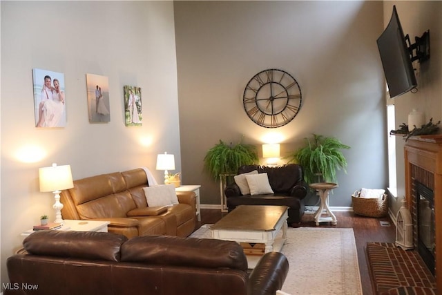 7509 Galena Ave NW, Canal Fulton, OH 44614 - living room with a glass covered fireplace, wood finished floors, and a high ceiling