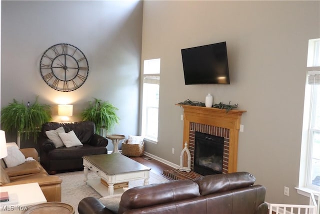 7509 Galena Ave NW, Canal Fulton, OH 44614 - living room featuring wood finished floors, plenty of natural light, and a fireplace