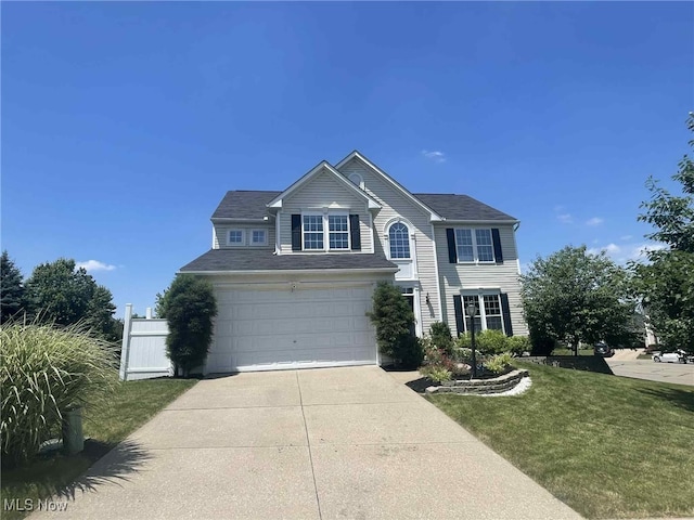 7509 Galena Ave NW, Canal Fulton, OH 44614 - traditional-style house featuring an attached garage, concrete driveway, and a front lawn