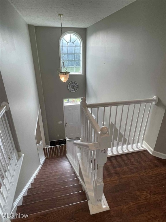 7509 Galena Ave NW, Canal Fulton, OH 44614 - staircase with wood finished floors and a textured ceiling