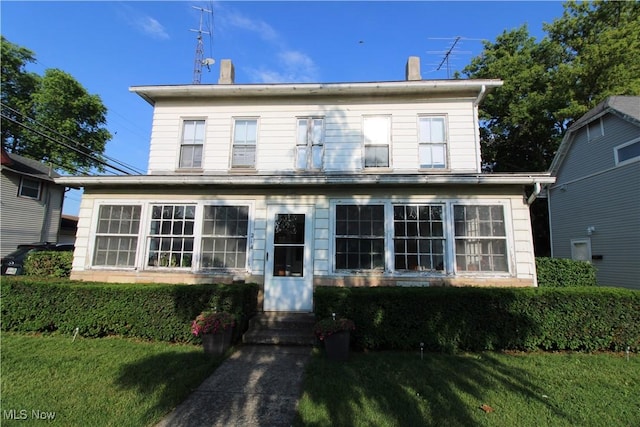 214 Fulton St, Port Clinton, OH 43452 - view of front of home featuring a front lawn