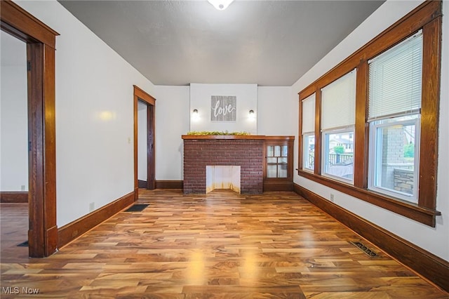 3006 6th St SW, Canton, OH 44710 - unfurnished living room with wood finished floors and baseboards