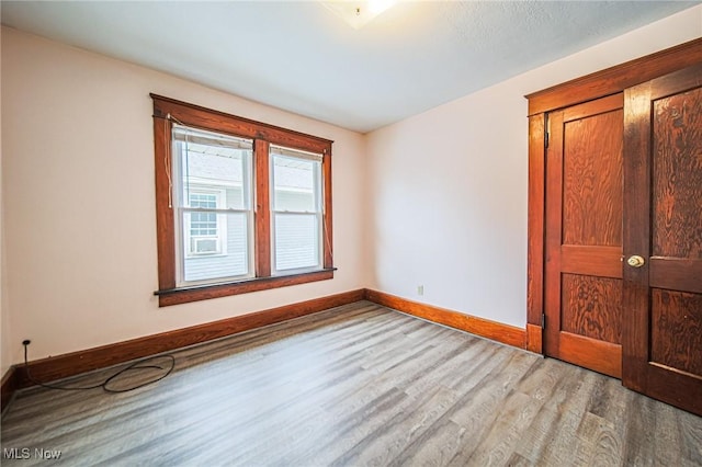 3006 6th St SW, Canton, OH 44710 - spare room with light wood-style flooring and baseboards