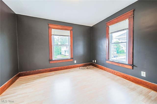 3006 6th St SW, Canton, OH 44710 - empty room with wood finished floors and healthy amount of natural light