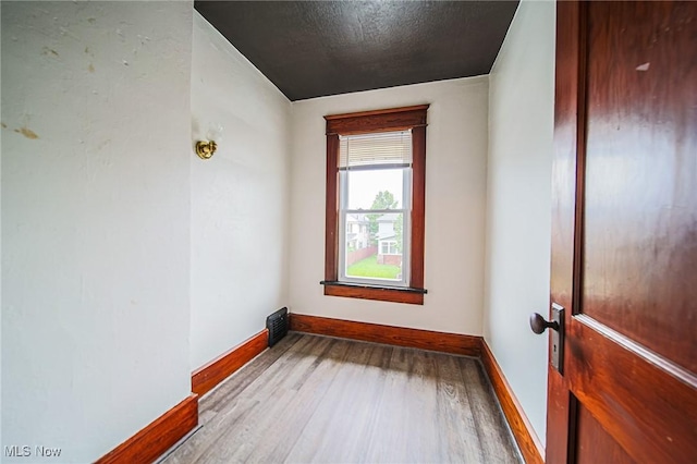 3006 6th St SW, Canton, OH 44710 - unfurnished room featuring wood finished floors and a textured ceiling
