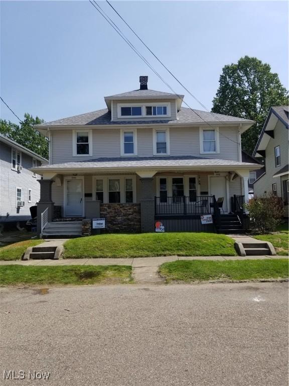 3006 6th St SW, Canton, OH 44710 - traditional style home with a porch and a front lawn