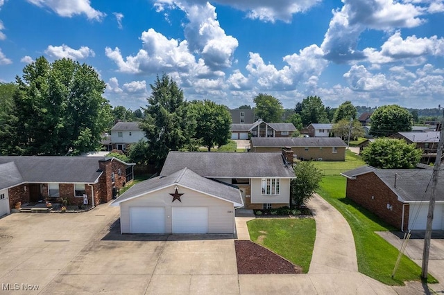 1565 Lois St, Belpre, OH 45714 - view of front of home featuring a residential view, a front yard, and a garage