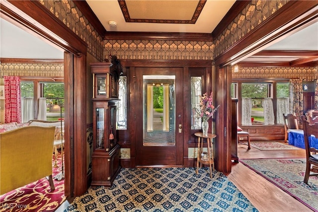 10921 Wade Park Ave, Cleveland, OH 44106 - entryway with wood finished floors and crown molding