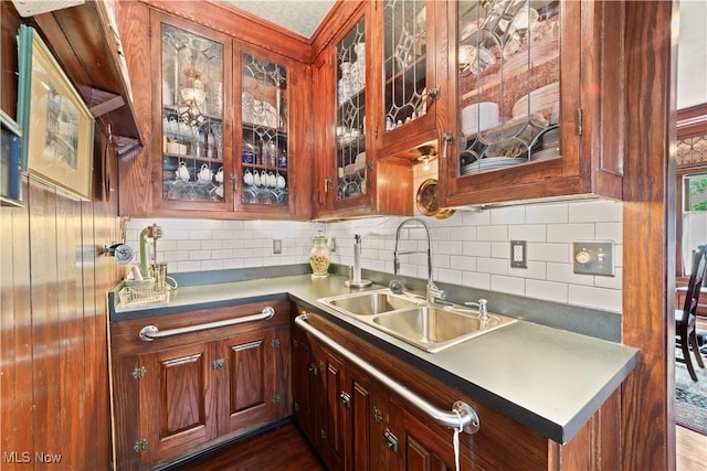 10921 Wade Park Ave, Cleveland, OH 44106 - bar area featuring backsplash and dark wood-style floors