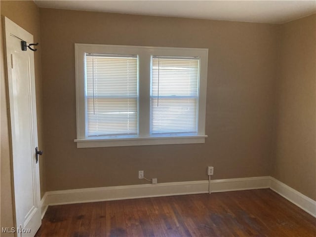 7508 Theota Ave, Parma, OH 44129 - unfurnished room featuring dark wood-style floors and baseboards