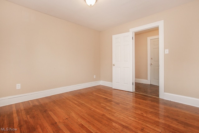 7508 Theota Ave, Parma, OH 44129 - spare room with hardwood / wood-style floors and baseboards