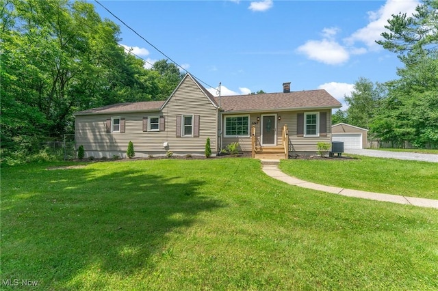 5843 Fairlawn Ave, Hubbard, OH 44425 - single story home featuring a chimney, a front yard, an outbuilding, and a garage