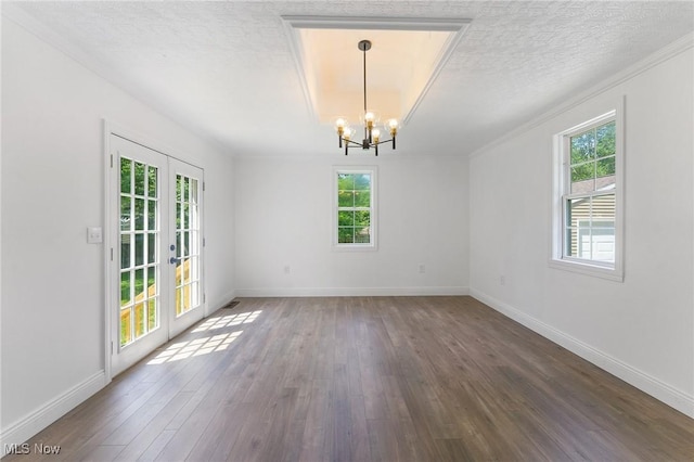 5843 Fairlawn Ave, Hubbard, OH 44425 - spare room featuring a chandelier, wood finished floors, french doors, a textured ceiling, and crown molding