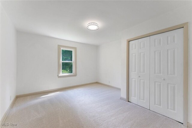 5843 Fairlawn Ave, Hubbard, OH 44425 - unfurnished bedroom featuring carpet floors and a closet