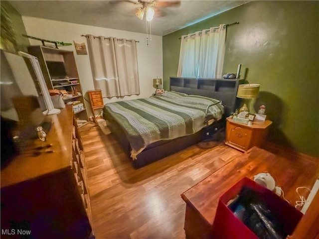 7328 S Calhoun Hwy, Mount Zion, WV 26151 - bedroom with wood finished floors and a ceiling fan