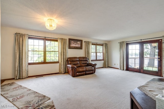 3613 Peninsula Dr, Akron, OH 44319 - sitting room with carpet, a chandelier, and a textured ceiling