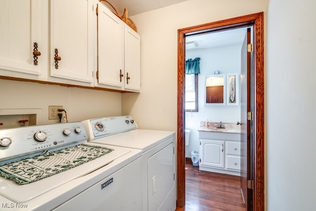 3613 Peninsula Dr, Akron, OH 44319 - washroom featuring washer and dryer, dark wood finished floors, and cabinet space