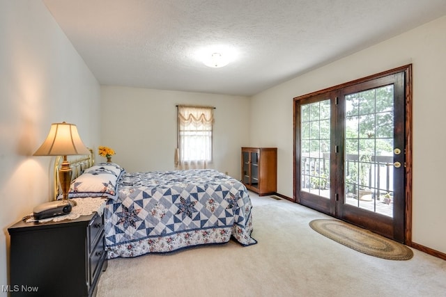 3613 Peninsula Dr, Akron, OH 44319 - bedroom with light carpet, access to exterior, multiple windows, and a textured ceiling